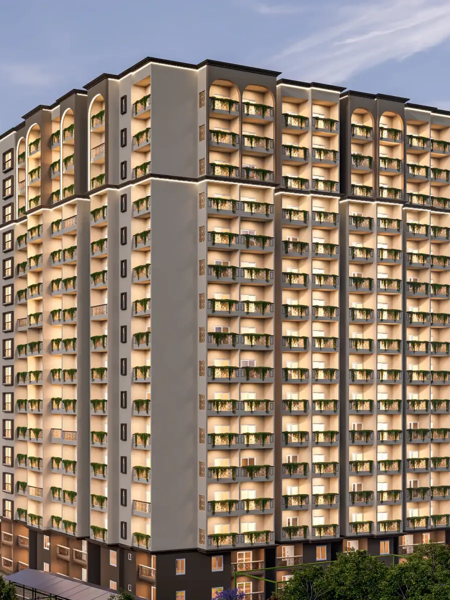 The lit apartment tower of DS Max Sky Sukhino at dusk