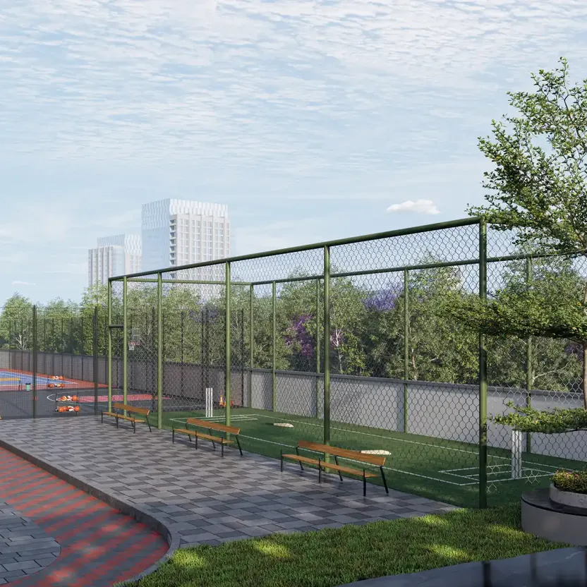 A netted sports court beside a paved walk at DS Max SkySampurn